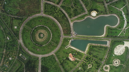 Aerial view of green park and little lakes.