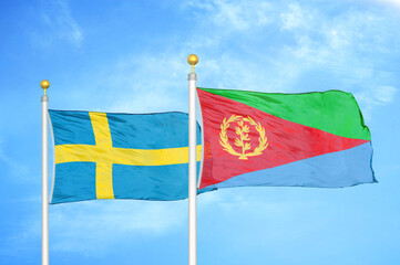 Sweden and Eritrea two flags on flagpoles and blue sky