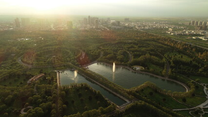 Aerial view of green park and little lakes.