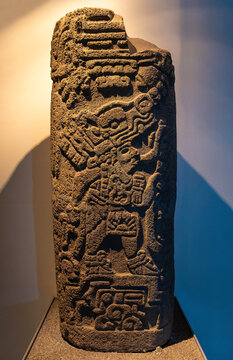 Maya Stelae With Bas Relief Of The God Quetzalcoatl, The Feathered Serpent, Mexico City, Mexico.