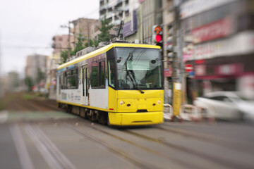 Tokyo,Japan-July 30, 2020: A tram car passing Machiya station rail crossing in Tokyo, Japan
