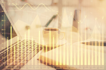 Double exposure of financial chart drawing and desktop with coffee and items on table background. Concept of forex market trading