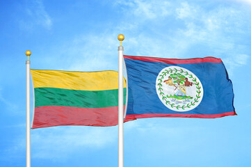 Lithuania and Belize two flags on flagpoles and blue sky