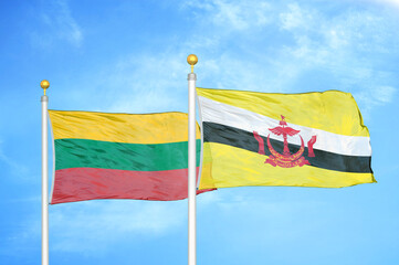 Lithuania and Brunei two flags on flagpoles and blue sky