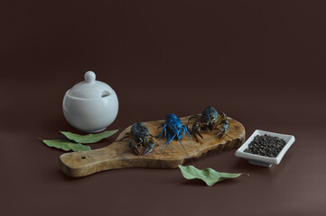 river blue crayfish fresh on kitchen board on brown background