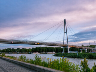 Fototapeta na wymiar Modern pedestrian bridge In Gizycko Port during sunrise, Poland.