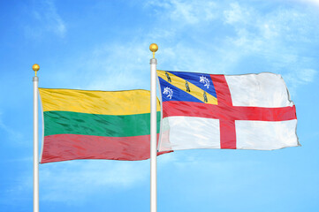 Lithuania and Herm two flags on flagpoles and blue sky