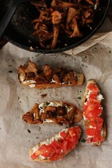 Bruschetta with red tomatoes and chanterelles macro