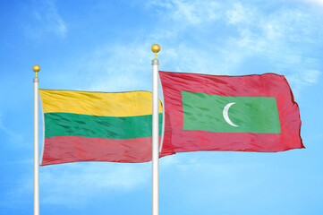 Lithuania and Maldives two flags on flagpoles and blue sky