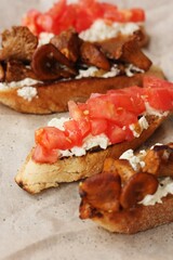 Bruschetta with red tomatoes and chanterelles macro