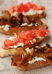 Bruschetta with red tomatoes and chanterelles macro