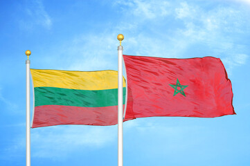 Lithuania and Morocco two flags on flagpoles and blue sky