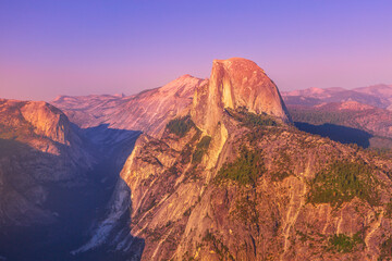 sunset close-up of Half Dome from Glacier Point lookout in Yosemite National Park, California, United States of America. View from Glacier Point: Half Dome, Clouds Rest, Liberty Cap in Yosemite Valley