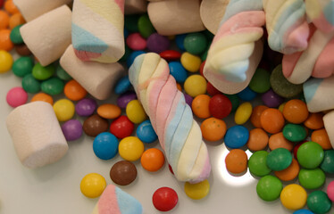 Different sweets decorating a beautiful party table.