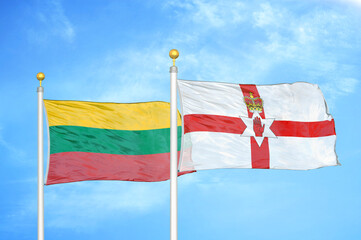 Lithuania and Northern Ireland two flags on flagpoles and blue sky