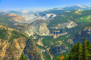 Glacier Point lookout in Yosemite National Park, California, United States. View from Glacier Point: Liberty Cap on top of Yosemite Valley, Vernal Falls and Nevada Fall waterfalls.