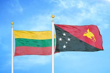 Lithuania and Papua New Guinea two flags on flagpoles and blue sky