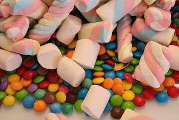Different sweets decorating a beautiful party table.