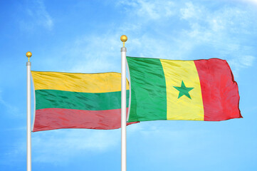 Lithuania and Senegal two flags on flagpoles and blue sky