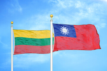 Lithuania and Taiwan two flags on flagpoles and blue sky
