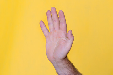 Naklejka premium Man hand showing sign Stop 