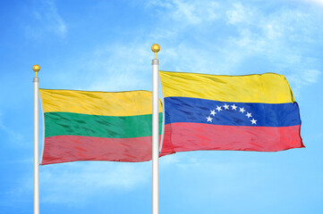 Lithuania and Venezuela two flags on flagpoles and blue sky