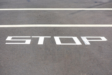 Temporarily STOP warning traffic sign painted on street surface
