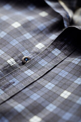 Close up of Men's checkered shirt.	