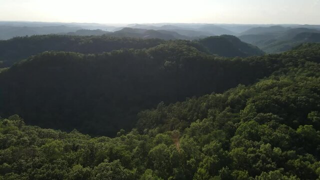 Aerial view of Red River Gorge, Kentucky. Part of Daniel Boone National Forest. Panning Left, Rolling Hills, Sunshine