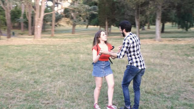 young man tries to justify himself with his girlfriend who furiously slaps him