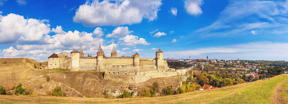 Autumn landscape, panorama, banner - view of a medieval fortified castle on a hill, the town of Kamianets-Podilskyi, Ukraine