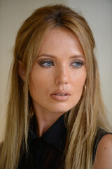 Young beautiful businesswoman with blond hair indoors