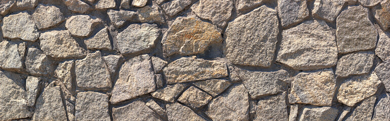 Old weathered gray stone wall on a city street, banner, horizontal grunge background
