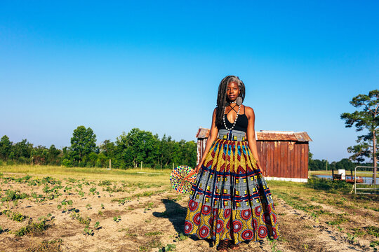Moody portrait of black woman with pretty African centric dress