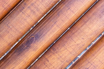 dark brown log pattern, ribbed background oblique base parallel trunks