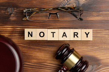 Concept of a notary next to the judge hammer
