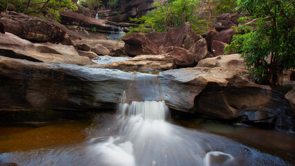 waterfall in a river with silk teepee water