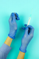 doctor's hands with syringe and vaccine, pandemic virus vaccination, medical healthcare and treatment concept