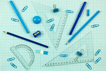 monochrome background with set of blue stationery. school learning and education concept.