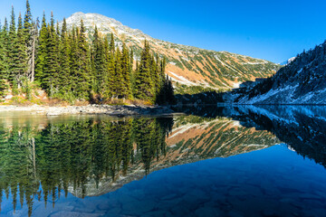 Alpine Lake Reflection at the end of a Hike in Fall in British Columbia Roar Lake 