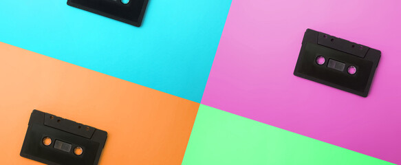 panoramic - close-up cassette tapes, presented in pastel colors, pink, green