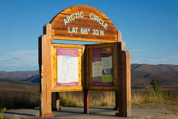 Fotobehang Northern Adventure Landmark, Arctic Circle sign on the Dempster Highway Over Land misson  © Ryan