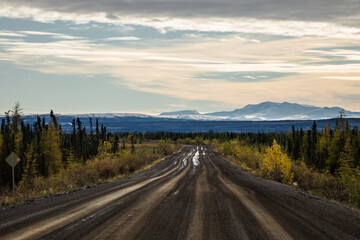 Dempster Highway in fall from the middle of the road. with Mountains in the distance,  Open Road Adventure 