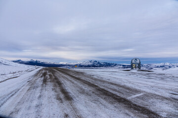 Welcoming sign to the Northwest Territories after snowfall on Dempster Highway 