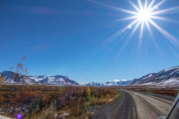 Dempster Highway Looking out at the road ahead in Fall sunshine Yukon