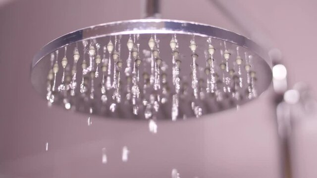 turning on water drops falling from shower bathroom slow motion