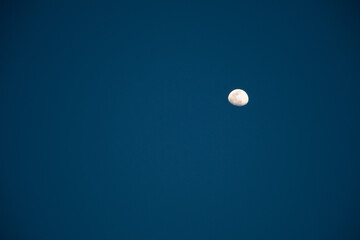 Gibbous Moon in  A Clear Blue Evening Sky
