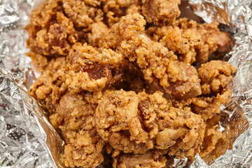 Deep fried chicken gizzards, an American soul food classic, shown here wrapped for takeout at a stand in York, Pennsylvania, USA