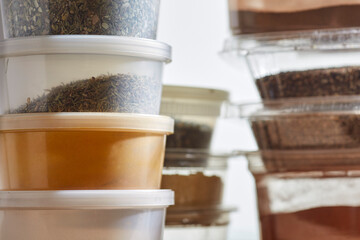 Amish bulk food items. Spices are packed in plastic containers at Amish bulk food stores in Pennsylvania, USA