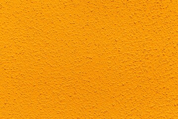 Patterned cement wall Vintage yellow painted texture and background